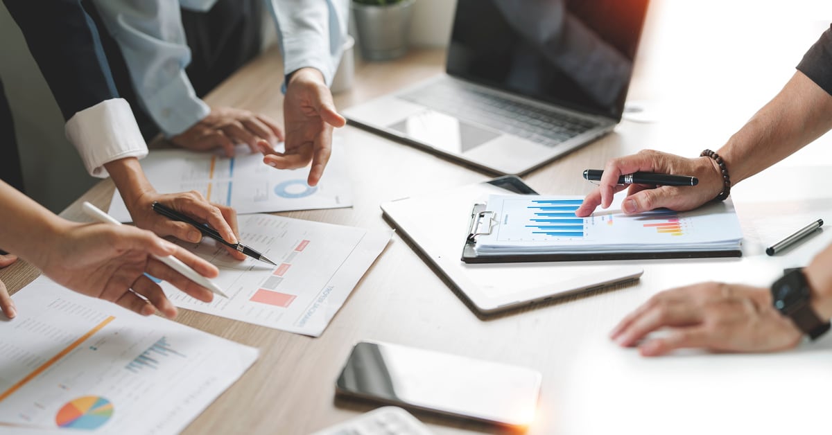 diverse coworkers working together in boardroom, brainstorming,